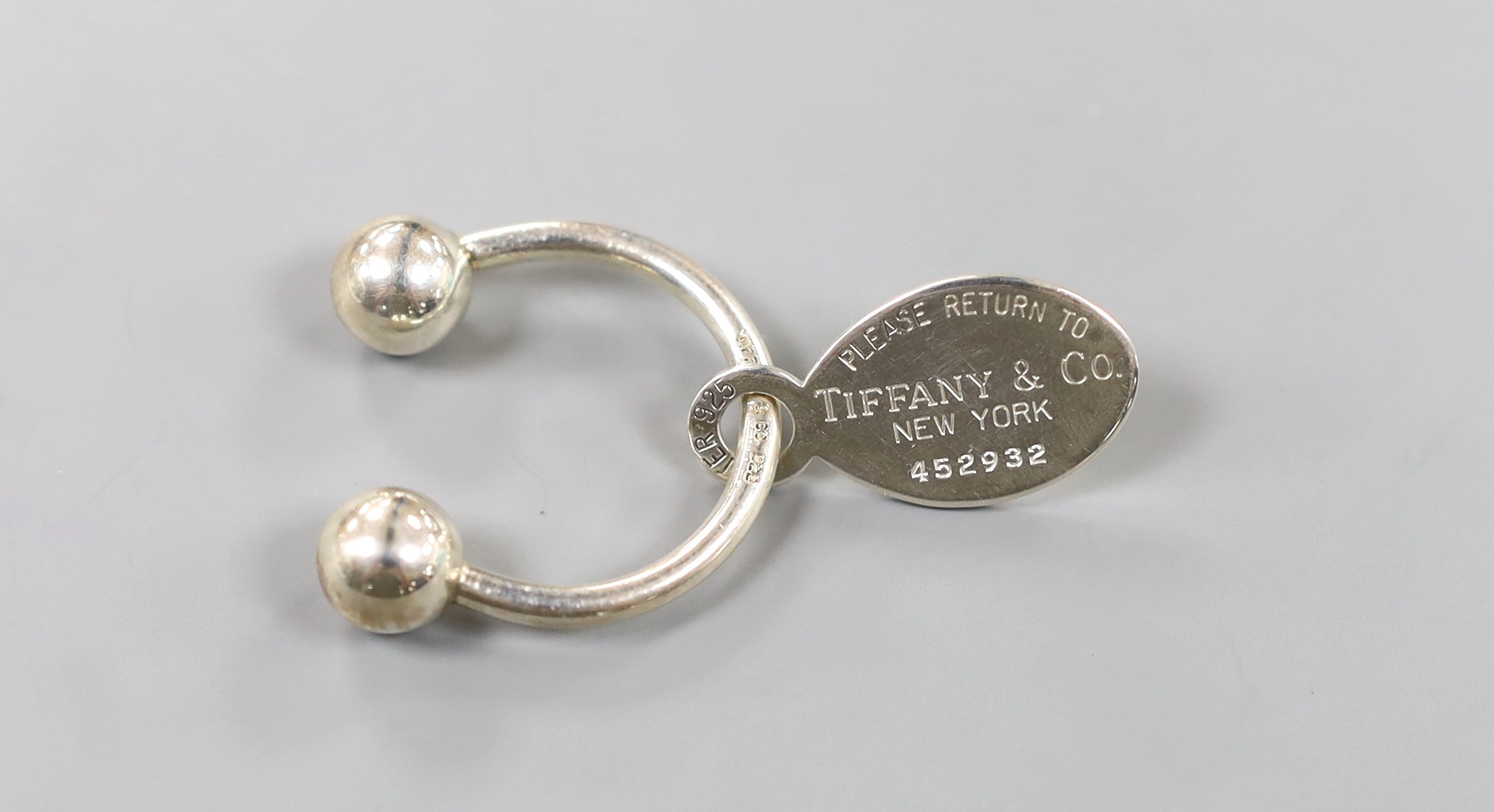 A modern Tiffany & Co sterling 925 keyring, 27mm, with pouch and box.